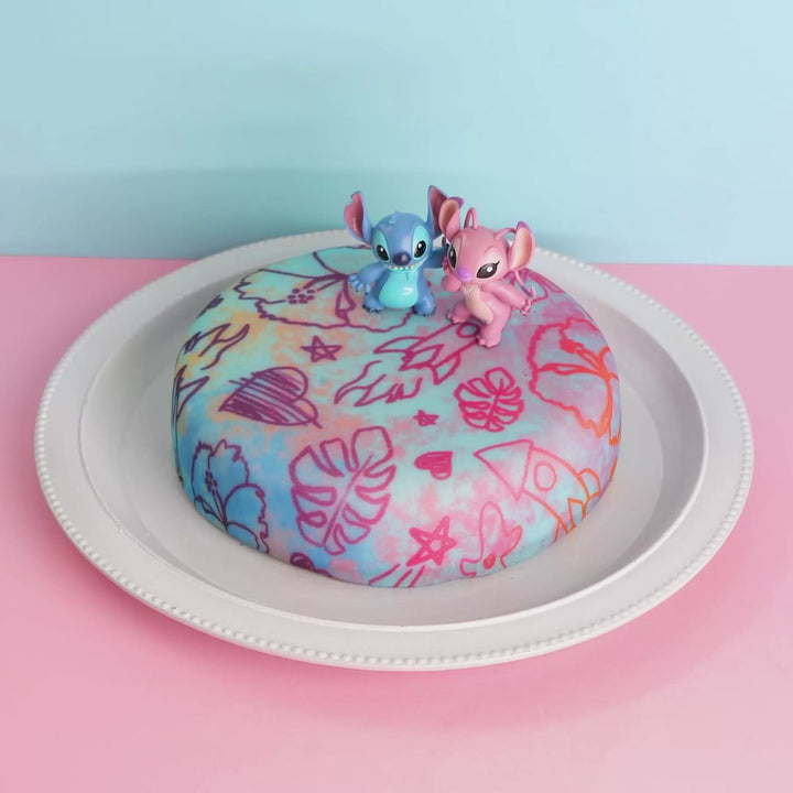Angel &amp; Stitch® på tårta